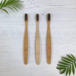 Bamboo toothbrushes with soft, charcoal infused nylon bristles. The handles are engraved with an affirmation 'breathe' 'dream' or 'believe' | Available at Sage Folk