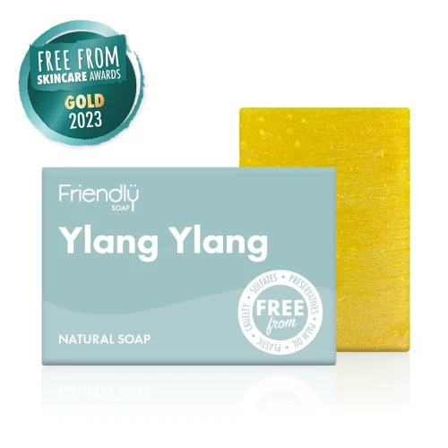 Award winning ylang ylang soap bar. The bar is a cheery yellow colour and is pictured next to the pale blue card boc packaging.